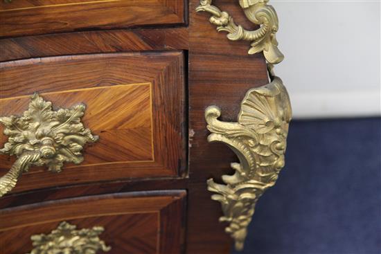 A Louis XV ormolu mounted kingwood bombe commode stamped L.M.Malle W.4ft 2in. D.2ft 2in. H.2ft 11in.